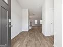 Inviting foyer featuring light gray walls, wood-look floors, and a view into the spacious living area at 342 Overlook Rd, Walnut Grove, GA 30052