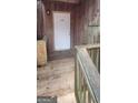 Entrance to a home featuring address number, and a weathered wood porch at 5796 Par Four Ct, Lithonia, GA 30038