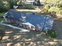 Expansive home with a large yard, mature trees, and long driveway, showcasing ample outdoor space and privacy at 170 White Rd, Fayetteville, GA 30214
