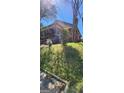 Exterior shot of a brick home with a screened porch; the yard needs a bit of maintenance at 586 Glen Iris Ne Dr, Atlanta, GA 30308