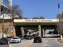 View of the Atlanta Beltline North Ave. Bridge, with traffic below, and a clear, sunny sky at 586 Glen Iris Ne Dr, Atlanta, GA 30308