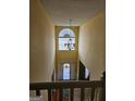 Grand foyer with high ceilings, a chandelier, and a large window allowing for ample natural light at 7354 Spoleto Loop, Fairburn, GA 30213