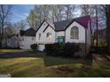 Charming two-story home featuring a two-car garage, with a beautiful front yard at 4911 Baker Plantation Way, Acworth, GA 30101