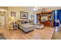 Cozy living room featuring a comfortable sofa, stylish decor, and a large entertainment center at 178 Norman Rd, Covington, GA 30014