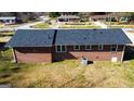 An aerial back view of the home with a brick exterior and well-kept lawn at 6268 Mount Zion Blvd, Morrow, GA 30260