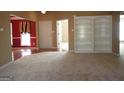 Inviting living room with built-in bookshelves and hardwood flooring visible, showcasing ample space and natural light at 180 Sunderland Cir, Fayetteville, GA 30215