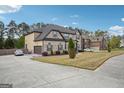 Charming two-story brick home with side-entry garage and long driveway at 3863 Rosebay Way, Conyers, GA 30094