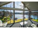 Bright sun room with a beautiful lake view, perfect for relaxation and enjoying nature at 2304 Larchmont Ct, Villa Rica, GA 30180
