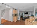 Open kitchen area with granite countertops, stainless steel appliances, and hardwood floors at 1191 Berryhill Dr, Lithonia, GA 30058
