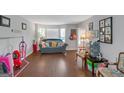 Bright living room featuring hardwood floors, neutral paint, and a large window at 1191 Berryhill Dr, Lithonia, GA 30058