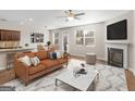 Bright living room featuring a fireplace, comfortable seating, and ample natural light at 1064 Lear Dr, Locust Grove, GA 30248