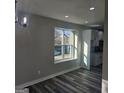 Inviting living room area with luxury vinyl plank flooring and view of kitchen at 3724 River Ridge Ct, Decatur, GA 30034