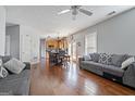 Open-concept living and dining area with hardwood floors and a view of the kitchen at 85 Clairidge Ln, Lawrenceville, GA 30046