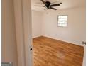 Cozy bedroom with hardwood floors and a ceiling fan, offering a comfortable and inviting space at 1433 Butler St, Jonesboro, GA 30236