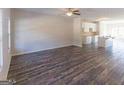 Open-concept living area featuring hardwood floors seamlessly connecting to a modern kitchen and dining area at 1946 Old Dogwood # 31, Jonesboro, GA 30238