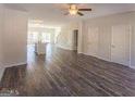 Spacious open-concept living area featuring hardwood floors and a seamless flow to the kitchen with a central island at 1946 Old Dogwood # 31, Jonesboro, GA 30238