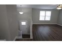 Inviting entryway with wood floors and a staircase leading to the upper level at 1897 Madras Ct, Lithonia, GA 30058