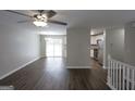 Spacious living room featuring elegant wood floors and bright natural light at 1897 Madras Ct, Lithonia, GA 30058