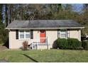 Single-story home with bright red front door, neutral siding, and manicured landscaping at 2336 Polar Rock Ave, Atlanta, GA 30315