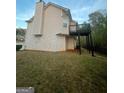 A view of the home's rear exterior showcasing a private wooden deck and natural surroundings at 3731 Patti Pkwy, Decatur, GA 30034