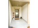 Charming front entrance with a decorative wreath, stylish doormat, and attractive wall decor at 5745 Pickens Garden Ln, Powder Springs, GA 30127
