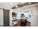 Modern kitchen featuring stainless steel appliances, an island, and hardwood floors at 4657 Elam Church Rd, Forest Park, GA 30297