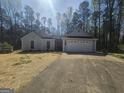 Charming single-story home featuring a two-car garage and a well-manicured front yard at 5802 Bay Pointe Sound Nw, Acworth, GA 30101