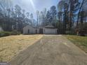 Charming single-story home featuring a two-car garage and a well-manicured front yard at 5802 Bay Pointe Sound Nw, Acworth, GA 30101