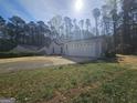 Charming single-story home featuring a two-car garage and a well-manicured front yard at 5802 Bay Pointe Sound Nw, Acworth, GA 30101