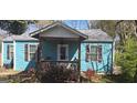 Inviting home showcasing a cozy, covered front porch with a ceiling fan at 1901 E Farris Ave, East Point, GA 30344