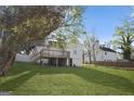 Spacious backyard featuring a wooden deck and lush green grass at 2377 Beecher Sw Rd, Atlanta, GA 30311