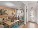 A traditionally styled living room is showcased, featuring cozy seating and natural light from the windows at 5864 Sunflower Ct, Ellenwood, GA 30294