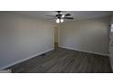 Bright, open living room featuring sleek flooring and modern ceiling fan at 263 Banberry Se Dr, Atlanta, GA 30315