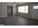 Bright living room with stylish gray flooring, a ceiling fan, and great natural light at 619 Church Nw St, Atlanta, GA 30318