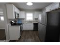 Modern kitchen with stainless steel appliances, granite countertops, and ample storage space at 2509 Appomattox Dr, Decatur, GA 30034