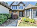 Charming home featuring stone accents, manicured landscaping and a stone walkway at 4852 Jacobs Cove Pt, Buford, GA 30519