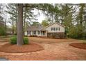 Charming single-Gathering home featuring a cozy front porch and well-maintained landscaping at 35 East Honeysuckle Ln, Carrollton, GA 30116