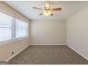 Serene bedroom with soft carpeting, two windows and a neutral color scheme that create a relaxing atmosphere at 3465 Tulip Dr, Decatur, GA 30032