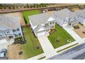 Aerial view of well maintained home showing the grassy lawn and well manicured landscaping at 4365 Sunflower Cir, Cumming, GA 30040