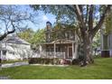 Charming two-story home with a inviting front porch and well-manicured lawn at 109 Bowen Cir, Atlanta, GA 30313