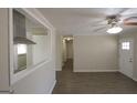 Spacious living room flows into hall and kitchen, featuring modern flooring at 5784 Sharon Dr, Norcross, GA 30071
