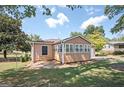 This home features a sunroom, attached garage, and a spacious yard, ideal for outdoor activities and relaxation at 2049 Nancy Se Cir, Smyrna, GA 30080