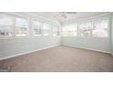 Bright sun room featuring plenty of windows and carpeted floors, perfect for relaxation or entertaining guests at 2049 Nancy Se Cir, Smyrna, GA 30080