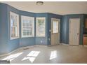 Bright dining area featuring large windows, tile floors, neutral color paint, and lots of light at 89 Farm Brook Ln # 17, Dallas, GA 30157