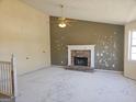 Spacious living room featuring vaulted ceiling, stone fireplace, ceiling fan and a window at 89 Farm Brook Ln # 17, Dallas, GA 30157