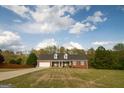 Charming, single-story brick home featuring a two-car garage and dormer windows at 237 Summerford Pl, Stockbridge, GA 30281