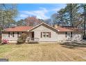 Charming single-story home featuring a welcoming front porch and traditional architecture at 104 Amberidge Nw Dr, Cartersville, GA 30121