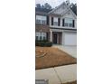 Charming two-story home with a well-maintained front yard and inviting curb appeal at 9487 Lakeview Rd, Union City, GA 30291