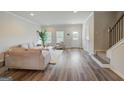 Comfortable living room with modern furniture, hardwood flooring, and natural light at 8654 Lakeview Commons # 38, Jonesboro, GA 30238