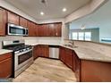 Modern kitchen showcasing stainless steel appliances, granite countertops, and wooden cabinetry at 3741 Upland Dr, Mcdonough, GA 30253